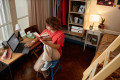 Diverse group of young people studying in kitchen interior at college dorm everyday scene